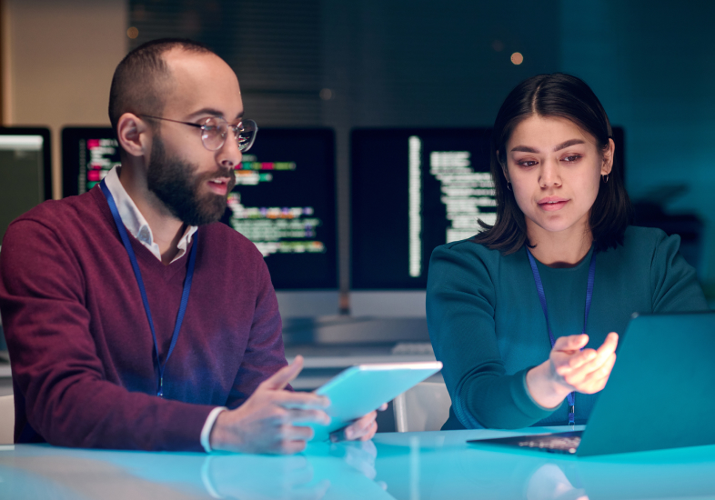 man and woman on computer